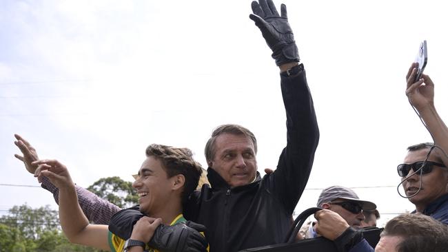 Jair Bolsonaro and federal deputy for the state of Minas Gerais Nikolas Ferreira wave to their supporters on September 30. Picture: Douglas Magno / AFP