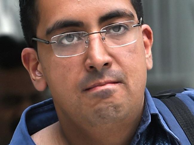 British national Yogvitam Pravin Dhokia arrives at the state court in Singapore on October 16, 2015. A young Briton facing criminal charges for walking into the track during last month's Singapore Grand Prix voluntarily went back to prison on October 16, an act that would reduce an anticipated jail term. AFP PHOTO / ROSLAN RAHMAN