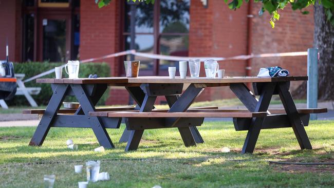 A picnic table at the scene is filled with glasses still. Picture: NCA NewsWire / Brandan Beckett