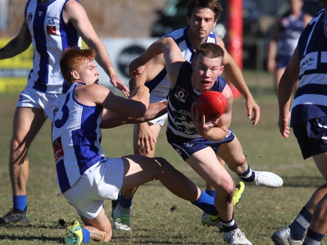 Round 13 QAFL Aussie rules game between Broadbeach and Mt Gravatt. Cats Kai Sheers breaks away from Vultures Zac Stone. Picture: Glenn Hampson