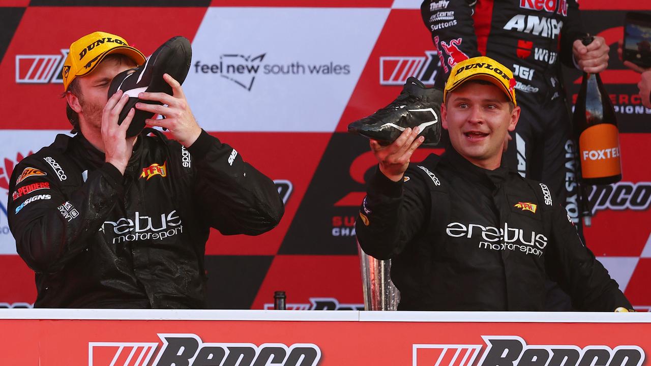 Brodie Kostecki and Todd Hazelwood complete shoeys after their Bathurst 1000 win. Picture: Getty Images