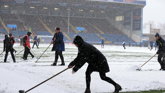 The snow continued to dump at Turf Moor and forced Burnley’s fixture against Spurs to be called off. Picture: Lindsey Parnaby/AFP