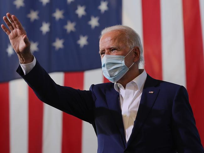 MIRAMAR, FLORIDA - OCTOBER 13: Wearing a face mask to reduce the risk posed by the coronavirus, Democratic presidential nominee Joe Biden waves to supporters during a drive-in voter mobilization event at Miramar Regional Park October 13, 2020 in Miramar, Florida. With three weeks until Election Day, Biden is campaigning in Florida.   Chip Somodevilla/Getty Images/AFP == FOR NEWSPAPERS, INTERNET, TELCOS & TELEVISION USE ONLY ==