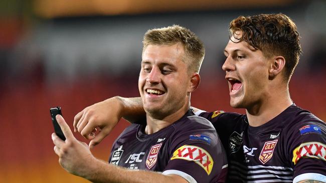 Cameron Munster (left) and Kalyn Ponga (right) of the Maroons are seen taking a selfie photograph after winning Game 1 of the 2019 State of Origin series between the Queensland Maroons and the New South Wales Blues at Suncorp Stadium in Brisbane, Wednesday, June 5, 2019. (AAP Image/Darren England) NO ARCHIVING, EDITORIAL USE ONLY