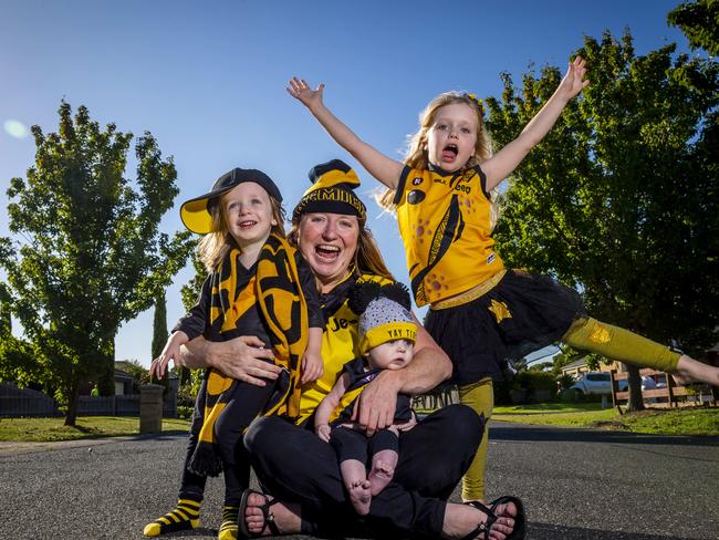 Richmond supporters are getting excited for the opening game of the AFL season on Thursday night. Jo Michielin and her kids Arthur, 5 months, Charlie, 2 and Lily, 5. Picture: Jake Nowakowski