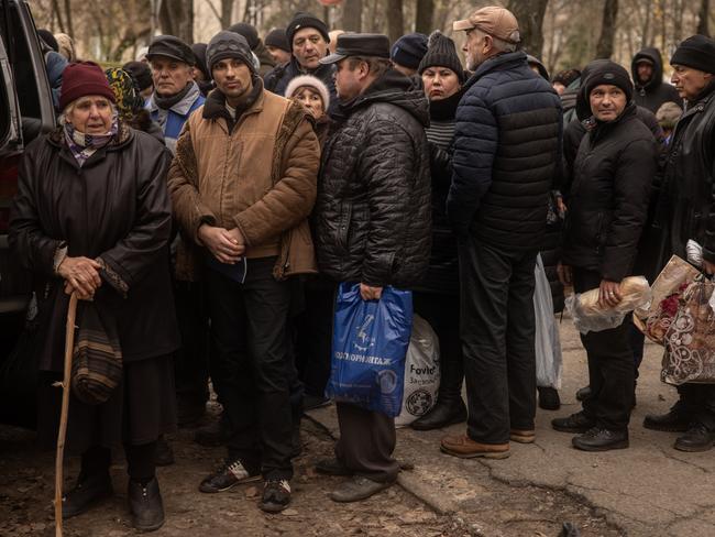 Residents wait to receive humanitarian aid in Kherson city centre in Kherson, Ukraine. Picture: Getty Images