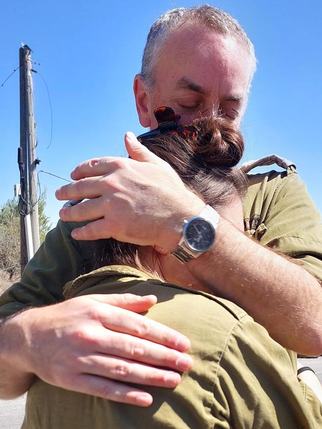 Dr John Borowski hugs his daughter, Prielle Borowski. Both are Australians and have been deployed to the frontlines during Israel’s war on Hamas in Gaza