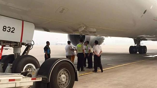 A flight was delayed after a late-running couple ran onto the tarmac and blocked the plane from taking off. Picture: WeChat