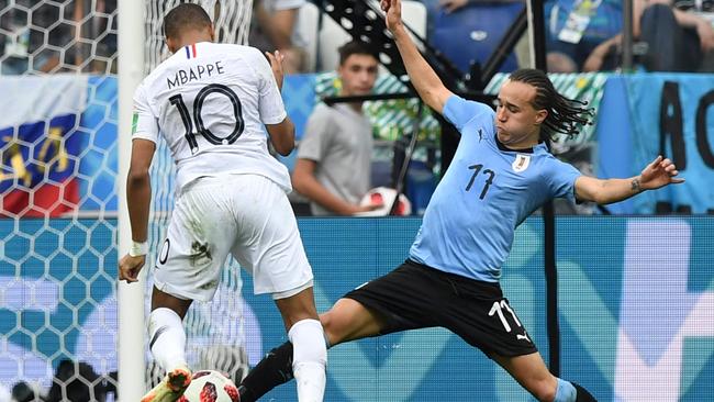 Kylian Mbappe takes on Uruguay’s defence during the quarter-final won 2-0 by France.