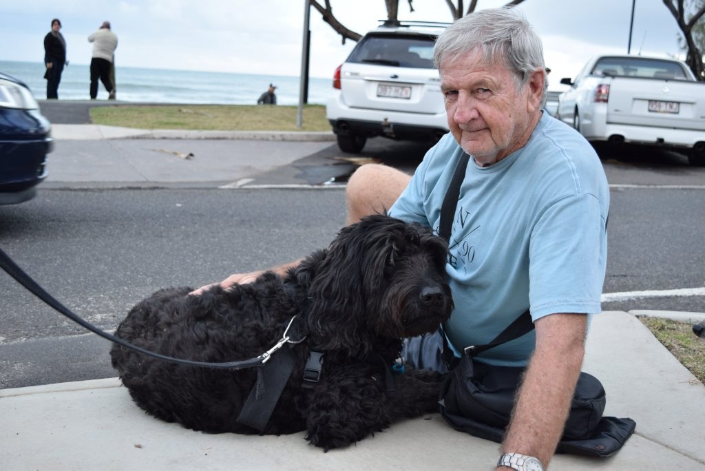 Brian Abbey comfort their dog Archie, recovering after a seizure at Mooloolaba Beach on Saturday, June 13, 2015. Photo Nicky Moffat / Sunshine Coast Daily. Picture: Nicky Moffat