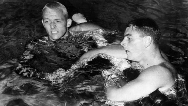 John Devitt (right) and silver medallist Lance Larson at the end of the 100m final in Rome, which ended in controversy.