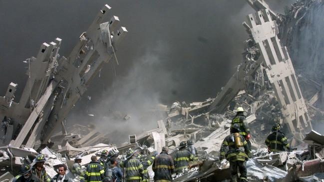 Firefighters make their way through rubble of the World Trade Centre in New York in 2001.