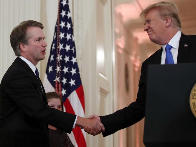 President Donald Trump shakes hands with Judge Brett Kavanaugh, his Supreme Court nominee, in the East Room of the White House. Picture: AP/Alex Brandon