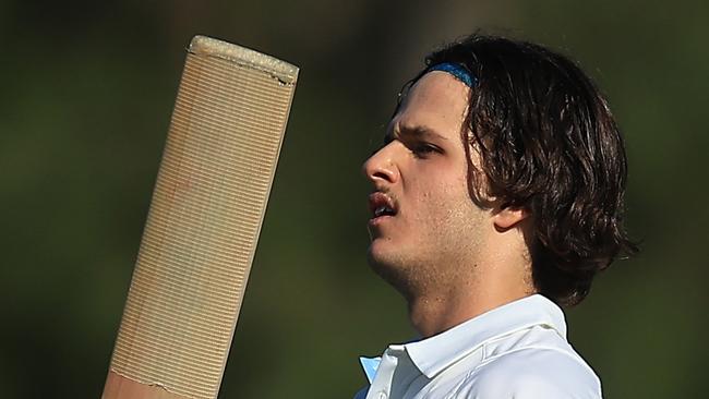 SYDNEY, AUSTRALIA - OCTOBER 10: Sam Konstas of the Blues raises his bat in the air after hitting a six to reach his century during the Sheffield Shield match between New South Wales and South Australia at Cricket Central, on October 10, 2024, in Sydney, Australia. (Photo by Mark Evans/Getty Images)