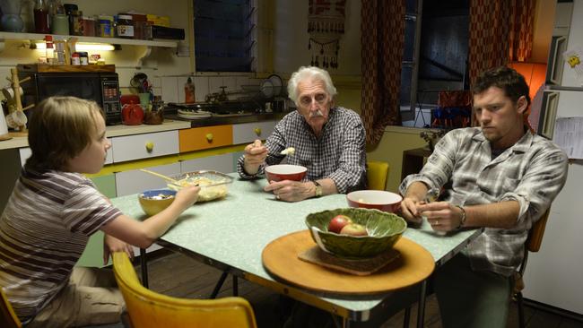 Family values ... Ed Oxenbould, Terry Norris and Sam Worthington in a scene from Paper Planes.