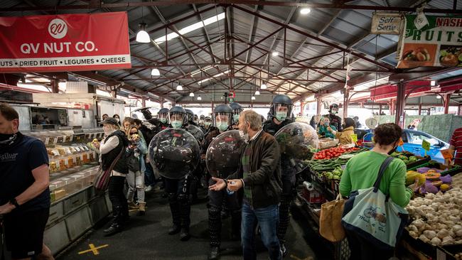 Market forces: Police make their presence felt in Melbourne’s Queen Victoria markets as lockdown drags on. Picture: Getty Images