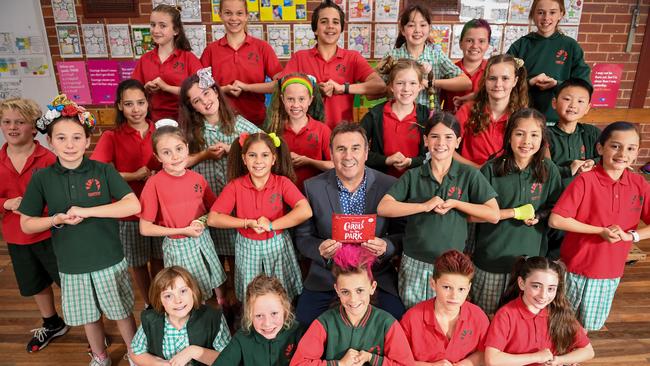 Hampton Primary School students - pictured with TV weather personality Mike Larkan late last year - are preparing to return to the classrooms. PICTURE: PENNY STEPHENS.