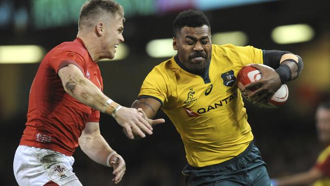 Australia’s Samu Kerevi tries to shrug a tackle from Wales’ Gareth Anscombe. Picture: AP