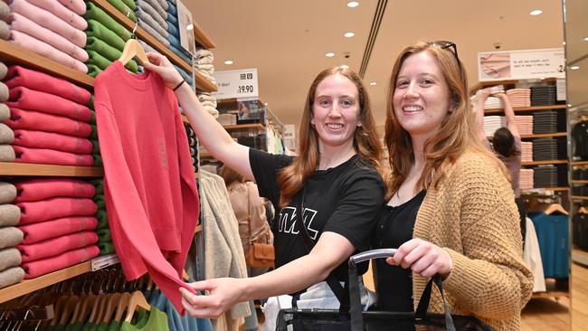 Kayla Young, 27, and Brianna Young, 29, check out the stock at Uniqlo, Westfield Marion. Picture: Keryn Stevens