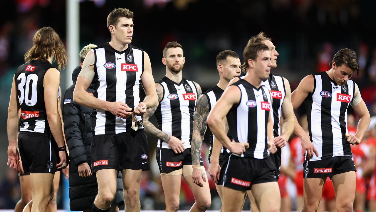 Collingwood players contemplate their first defeat in 12 weeks. Picture: Cameron Spencer/Getty Images