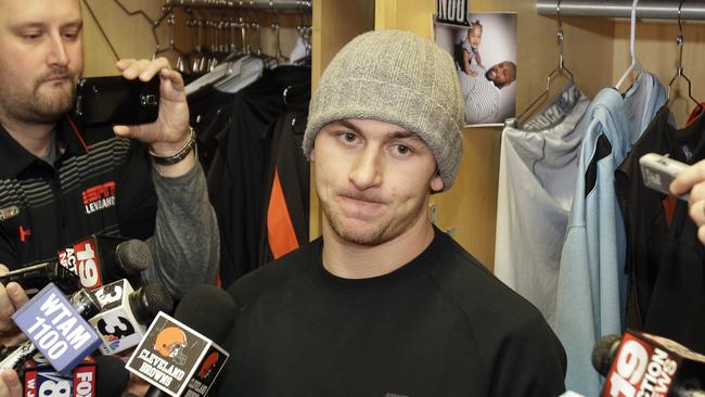 Then-Cleveland Browns quarterback Johnny Manziel talks with the media in late 2014.