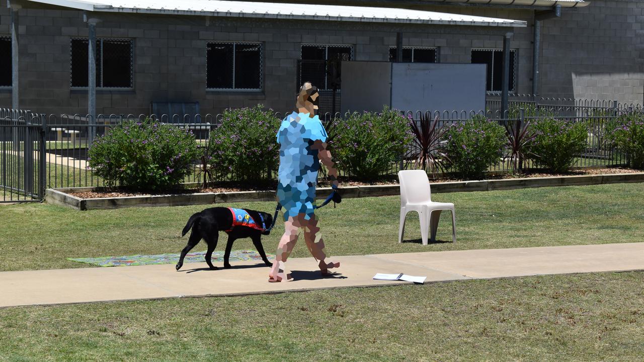 SQCC inmate trains her assistance dog. Photo: Hugh Suffell