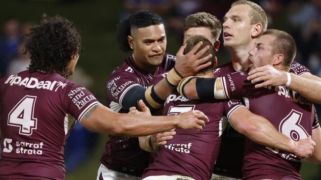 SUNSHINE COAST, AUSTRALIA - AUGUST 14: Tom Trbojevic of the Sea Eagles celebrates scoring a try with his teammates during the round 22 NRL match between the Manly Sea Eagles and the Parramatta Eels at Sunshine Coast Stadium, on August 14, 2021, in Sunshine Coast, Australia. (Photo by Glenn Hunt/Getty Images)