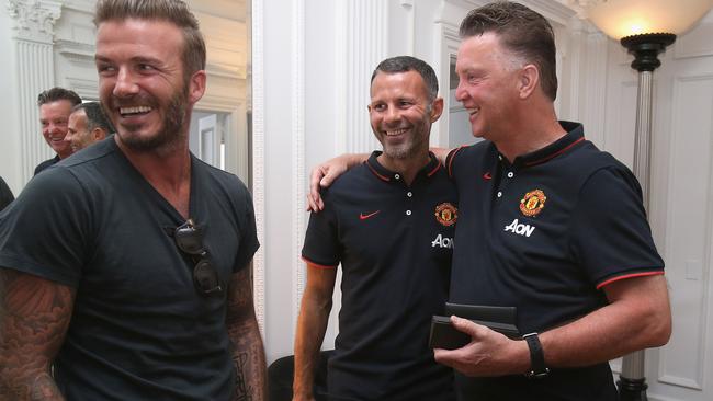 LOS ANGELES, CA - JULY 22: (EXCLUSIVE COVERAGE) (MINIMUM FEES APPLY -250 GBP PRINT & 125 GBP ONLINE OR LOCAL EQUIVALENT, PER IMAGE) Manager Louis van Gaal (R) of Manchester United and Assistant Manager Ryan Giggs (C) meet David Beckham at the team hotel as part of their pre-season tour of the United States on July 22, 2014 in Los Angeles, California. (Photo by Matthew Peters/Man Utd via Getty Images)