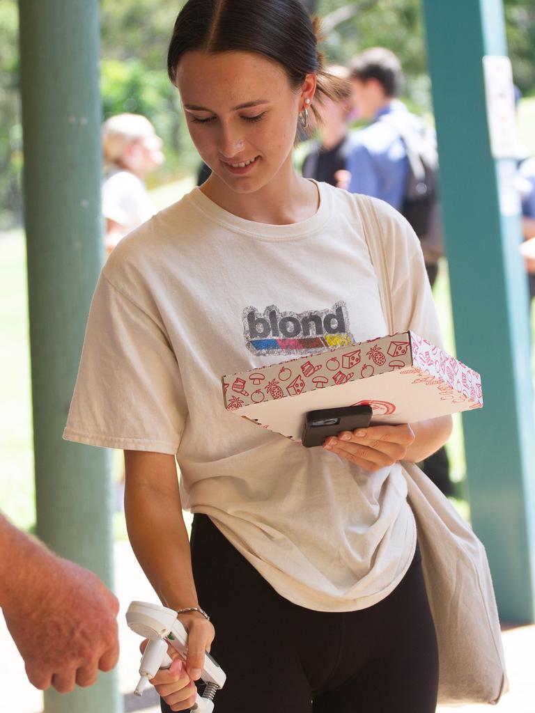 A student tries her hand at the grip strength challenge.