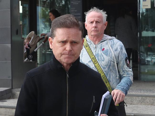 Jockey Danny Nikolic leaves the Broadmeadows Magistrate court along with Pat Lennon (behind). Picture: David Crosling