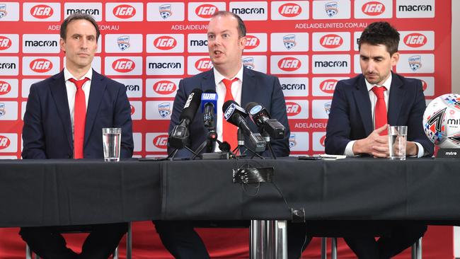 Aurelio Vidmar (left), Adelaide United chairman Piet van der Pol and Nathan Kosmina at Coopers Stadium on Wednesday. Picture: David Mariuz/AAP