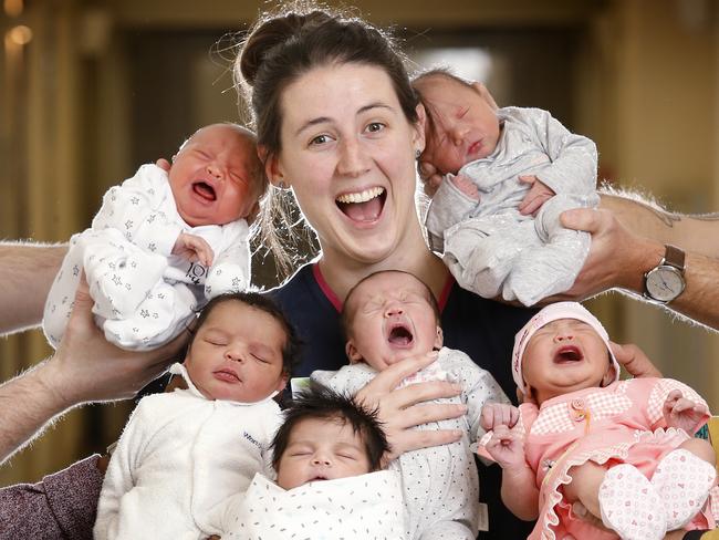 New born babies to mark the 25th million Australian at Sunshine Hospital. Mid wife Nicole Peterson surrounded by new born babies (L-R) Lily Anderson, Amir Mohamed, Siya Sharma, Selma Grudnik, Eden Ahern and Sabiha Razvi born at Sunshine Hospital.      Picture: David Caird