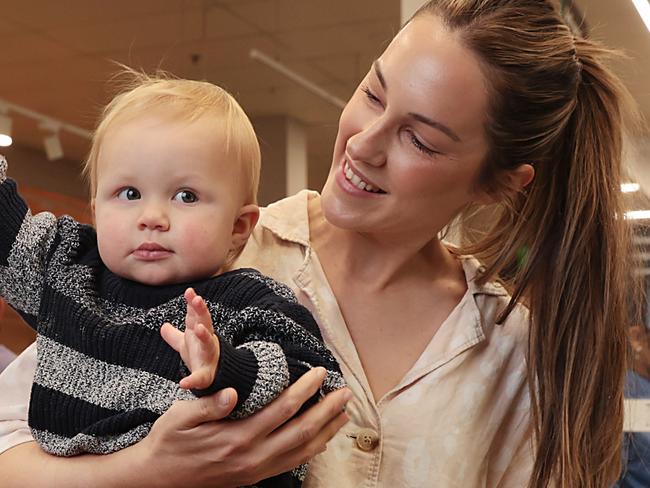 Woolworths supermarket shopper Beth Robertson with her son Max (1) at the confectionery free checkout. The supermarket chain is removing all confectionery from their checkouts to promote better eating and less battling with kids. Jane Dempster/The Daily Telegraph.