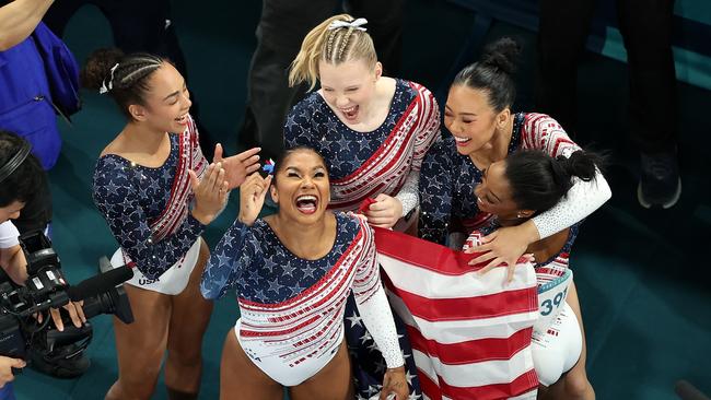 Winners are grinners. Photo by Dan Mullan/Getty Images.