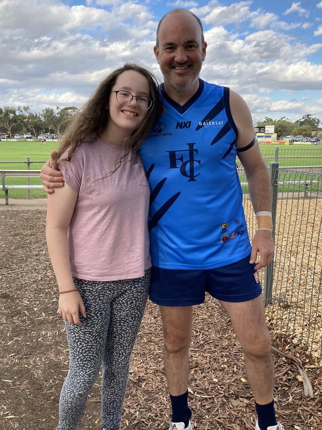 Brad Shiell with his daughter in his 2022 playing days. Picture: Supplied