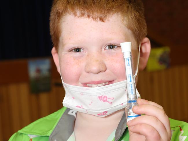 Braxton McLaglen, 7, takes a rapid antigen test. Picture: Alan Barber