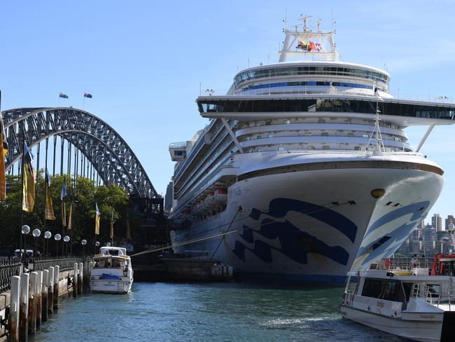 Cruise ship passengers disembark from the Princess Cruises at Circular Quay in Sydney.