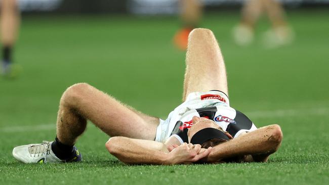 ADELAIDE, AUSTRALIA – APRIL 30: Nathan Murphy of the Magpies down after a head knock with Darcy Fogarty of the Crows during the 2023 AFL Round 07 match between the Adelaide Crows and the Collingwood Magpies at Adelaide Oval on April 30, 2023 in Adelaide, Australia. (Photo by Sarah Reed/AFL Photos via Getty Images)