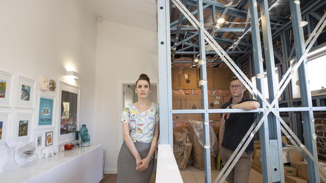 Scott Dundan and his partner Fiona Roberts in their Morphettville home, which resembles a building site. Picture Brett Hartwig