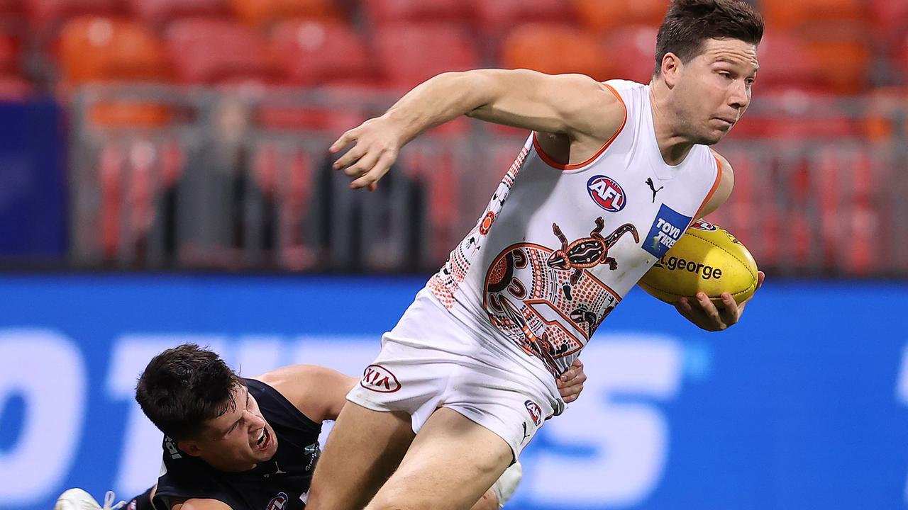 SYDNEY, AUSTRALIA – JUNE 19: Toby Greene of the Giants is tackled by Nic Newman of the Blues during the round 14 AFL match between the Greater Western Sydney Giants and the Carlton Blues at GIANTS Stadium on June 19, 2021 in Sydney, Australia. (Photo by Mark Kolbe/Getty Images)