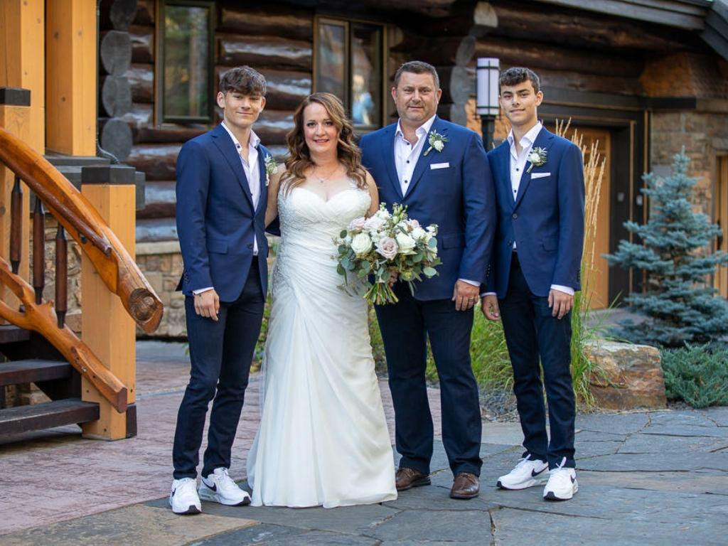 The couple on their wedding day with Jason’s two sons. Picture: news.com.au.