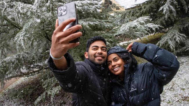 Chandula Thilakarathne and Aseli Dissanayake took a road trip to see the flurries at Mt Macedon. Picture: Mark Stewart