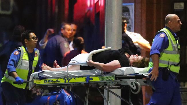 A person is taken out on a stretcher from the Lindt Cafe. Photo:Getty Images