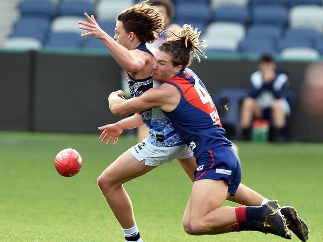 Sam Lowson brings down his Geelong opponent.