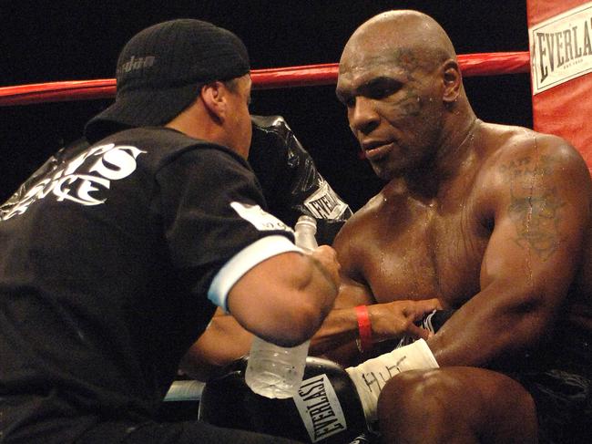 Fenech (L) gives Tyson some advice during his fight with McBride. Picture: Getty Images