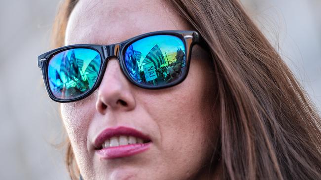 Sea of ‘Yes’ ... Greek flags and banners reading "Yes" are reflected in this woman’s sunglasses.