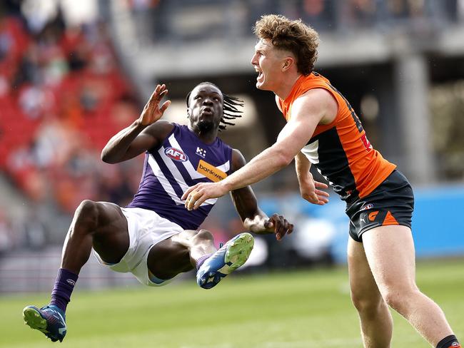 Giants Tom Green tackles Fremantle's Michael Frederick during the AFL Round 23 match between the GWS Giants and Fremantle Dockers at Engie Stadium on August 17, 2024. Photo by Phil Hillyard(Image Supplied for Editorial Use only - **NO ON SALES** - Â©Phil Hillyard )