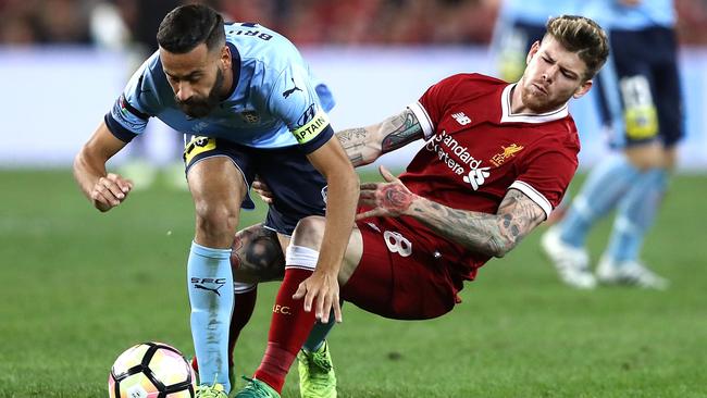 Alex Brosque of Sydney FC is tacked by Alberto Moreno of Liverpool. Picture: Getty Images