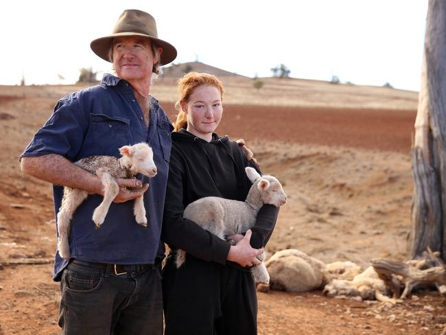 Farmer Les Jones with his daughter Lillie, 15, on their property at Goolhi with the remaining sheep in their flock. Picture: Sam Ruttyn