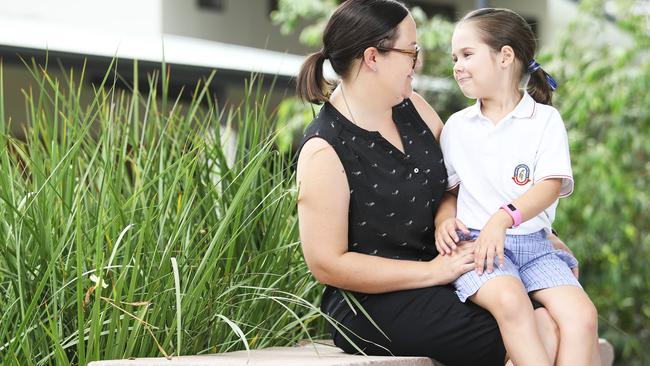 Quinn Malos, 6, and her mother Renae at Cannon Hill Anglican College in Brisbane. Picture: AAP/Claudia Baxter